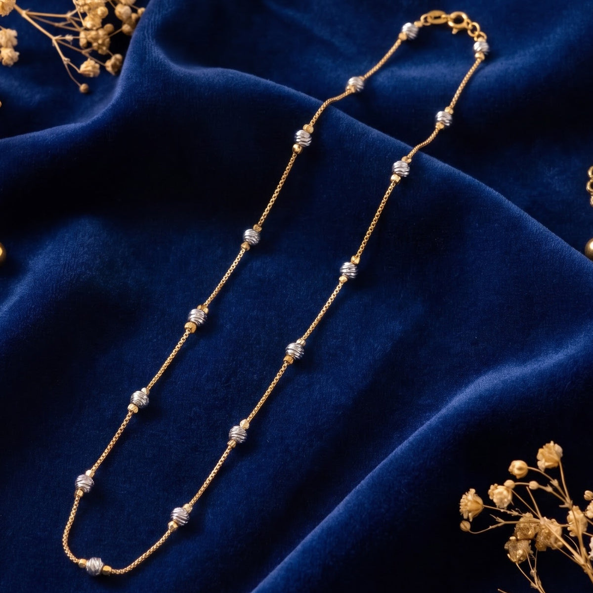 Gold chain with silver cluster bead