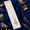 Silver chain with damroo and trishul pendant