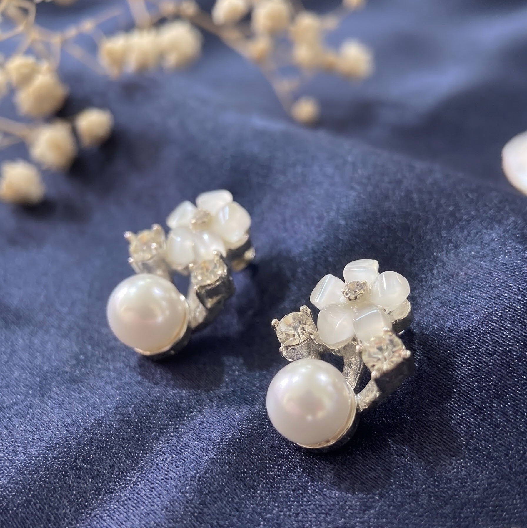 Pearl and stone studded earring
