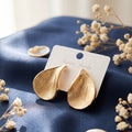 Gold tear drop stud with brushed textured