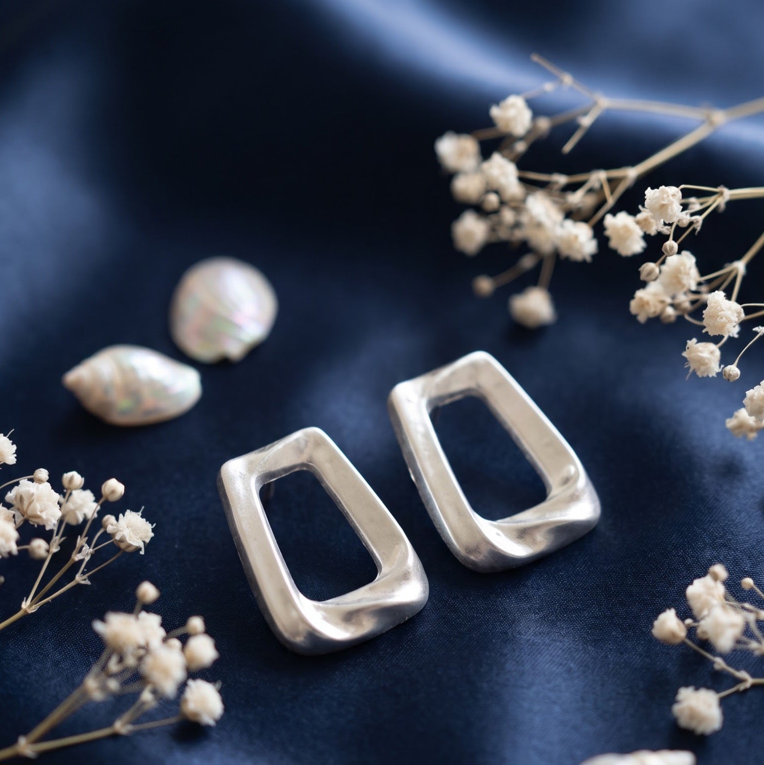 Matte silver open frame trapezoid stud earring