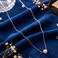 Silver delicate chain with stardust ball pendant