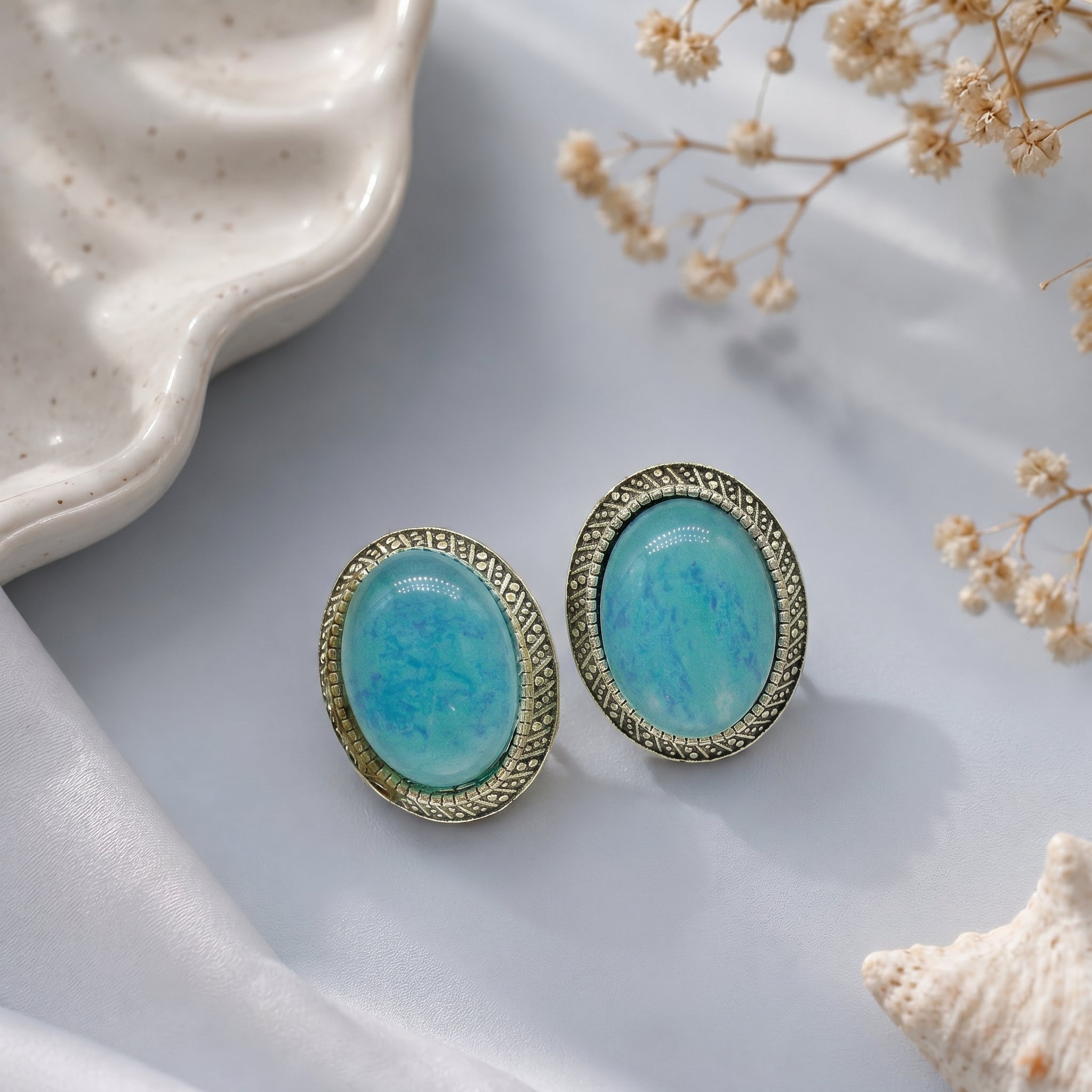Stone studded oval earring