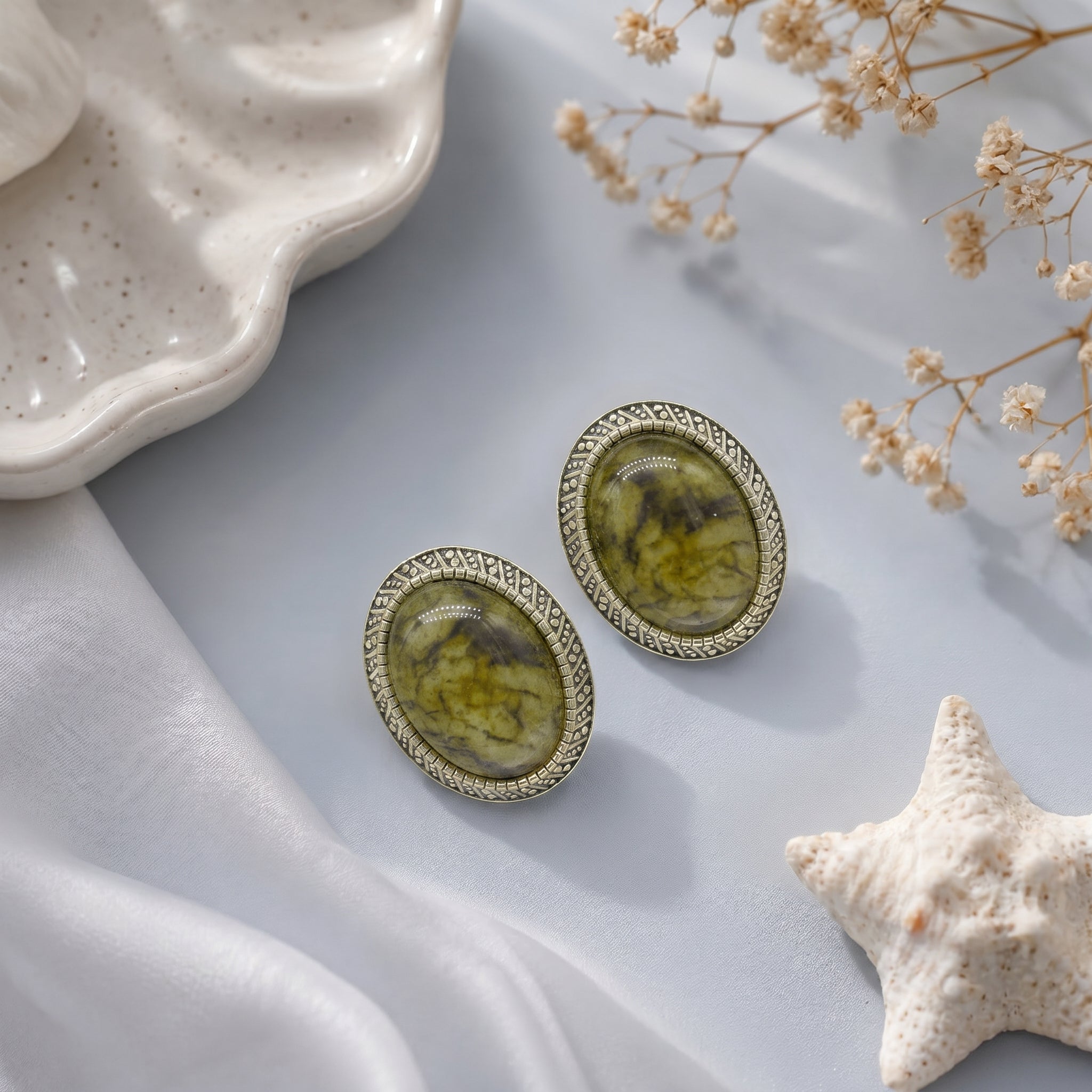 Stone studded oval earring