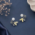 White enamel butterfly and pearl earring