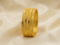 Round curved gold bangles